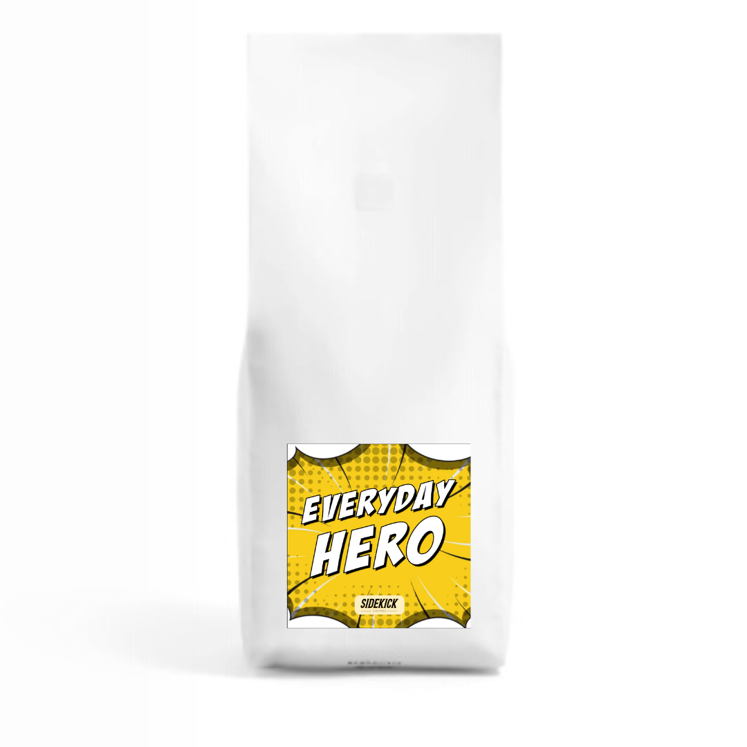 A bag of Everyday Hero Blend coffee with a yellow and white label.
